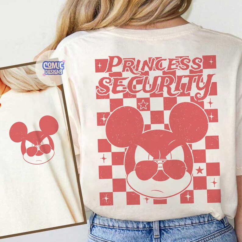 May include: Cream-colored t-shirt featuring a red graphic of a mouse-like character wearing sunglasses, with the words "PRINCESS SECURITY" above a checkered pattern. The design has a vintage, distressed look.