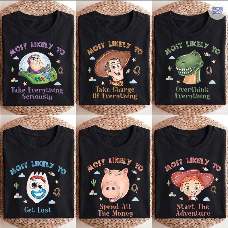 May include: Six black t-shirts featuring Toy Story characters. Each shirt displays the text Most Likely To followed by a unique phrase and character: Buzz Lightyear, Woody, Rex, Forky, Hamm, and Jessie, surrounded by small stars, clouds, and cacti.