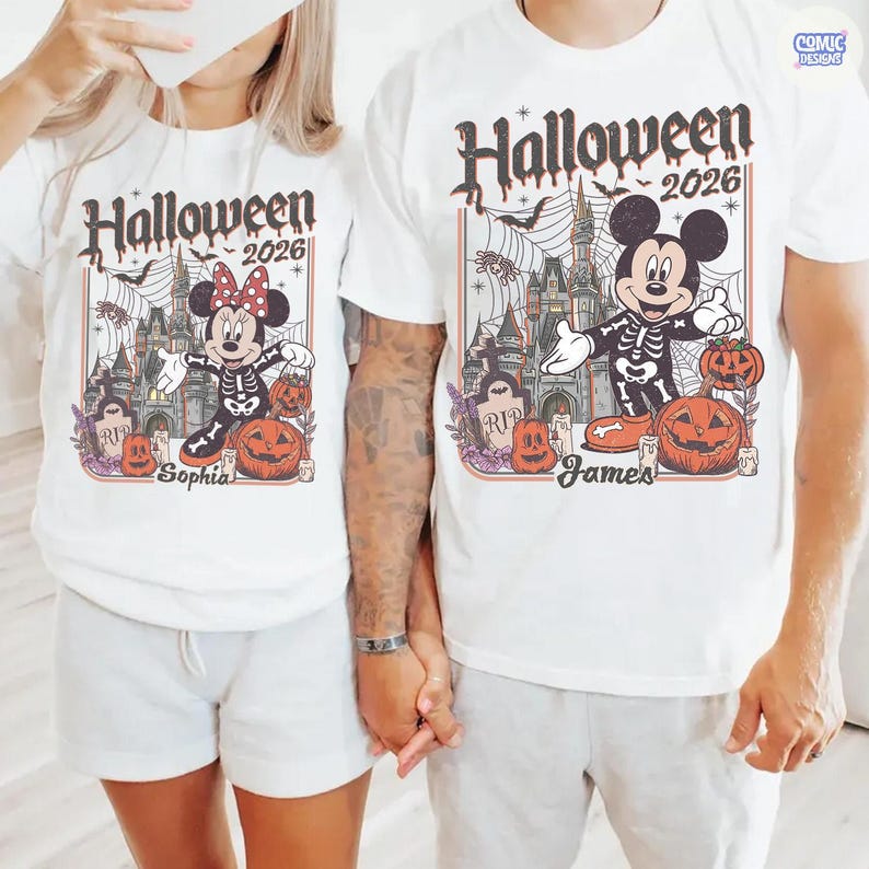 May include: White t-shirts with a Halloween 2026 design. The design features Mickey and Minnie Mouse dressed as skeletons, pumpkins, a castle, and the names "Sophia" and "James".
