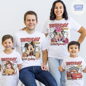 May include: White t-shirts with colorful cartoon character designs. The shirts feature Mickey Mouse, Minnie Mouse, Belle, and Lightning McQueen, with the words "Birthday Crew" and "Birthday Boy/Girl". The shirts are for a family, celebrating a birthday.