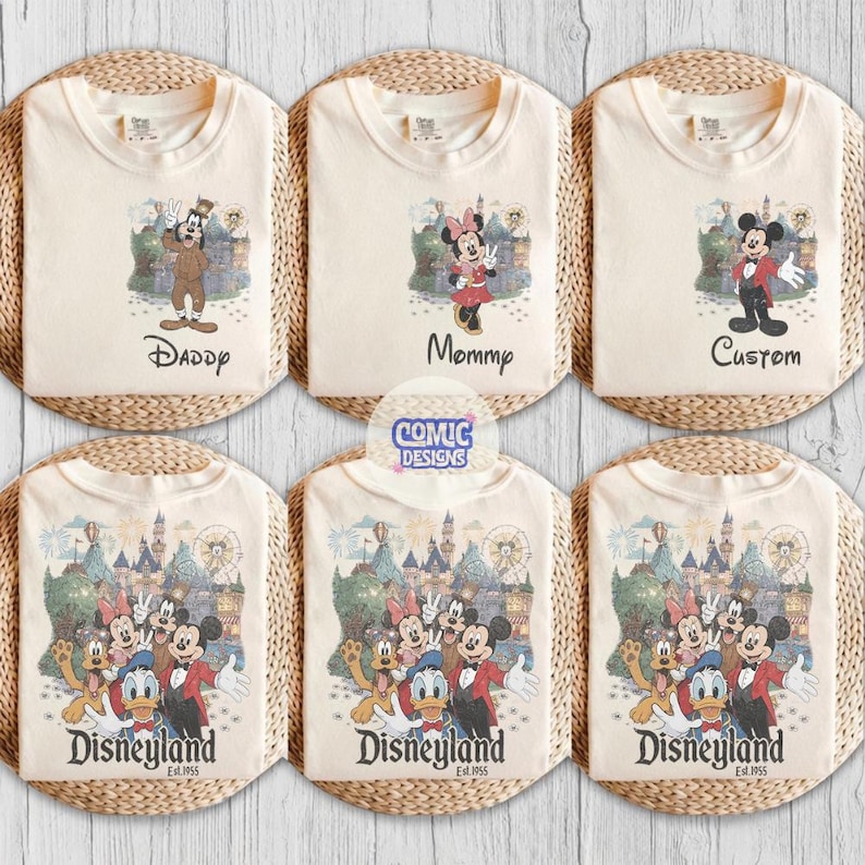 May include: Six off-white t-shirts featuring Disney character graphics. Three shirts show individual characters with text reading Daddy, Mommy, or Custom. Three shirts show a group of characters with the text Disneyland Est. 1955.