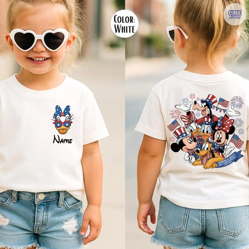 May include: White t-shirt featuring a cartoon character with sunglasses and a bow. The shirt has the word "Name" printed below the character. The back of the shirt features a group of cartoon characters with American flags and fireworks.