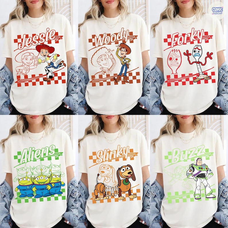 May include: A collection of six off-white t-shirts featuring Toy Story characters. Each shirt displays a character name, a line drawing, and a full-color illustration of Jessie, Woody, Forky, Aliens, Slinky, or Buzz Lightyear over a checkered pattern.