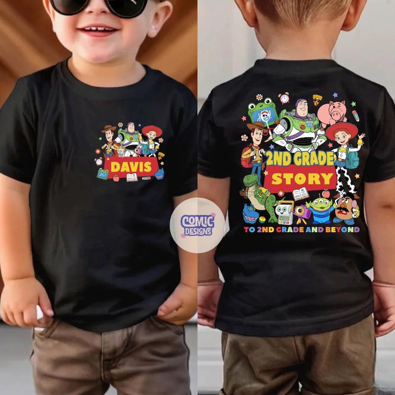 May include: A black t-shirt featuring a front graphic of Toy Story characters and the name DAVIS. The back displays a larger graphic of the same characters with the text 2ND GRADE STORY TO 2ND GRADE AND BEYOND, surrounded by colorful icons.