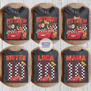 May include: Six dark gray t-shirts with colorful graphics. Designs include the text "Lyca's PIT CREW", "BIRTHDAY Boy", "SISTER 10", "LUCA 10", and "MAMA 10". Each shirt features a red race car and checkered flag elements.