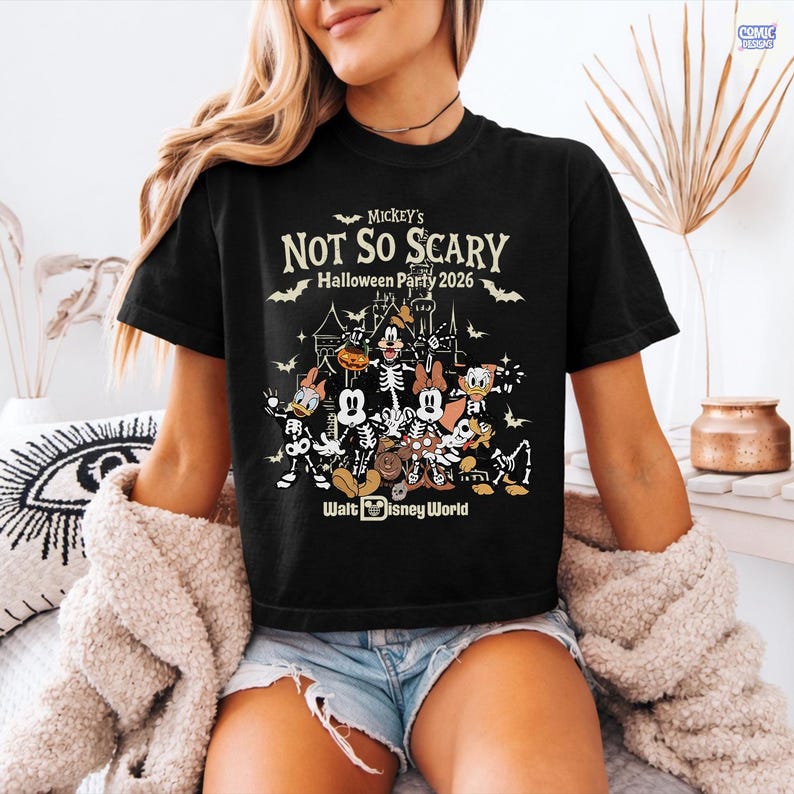 May include: Black t-shirt featuring a Halloween design with Mickey Mouse and friends as skeletons. The shirt includes the text "Mickey's Not So Scary Halloween Party 2026" and "Walt Disney World".