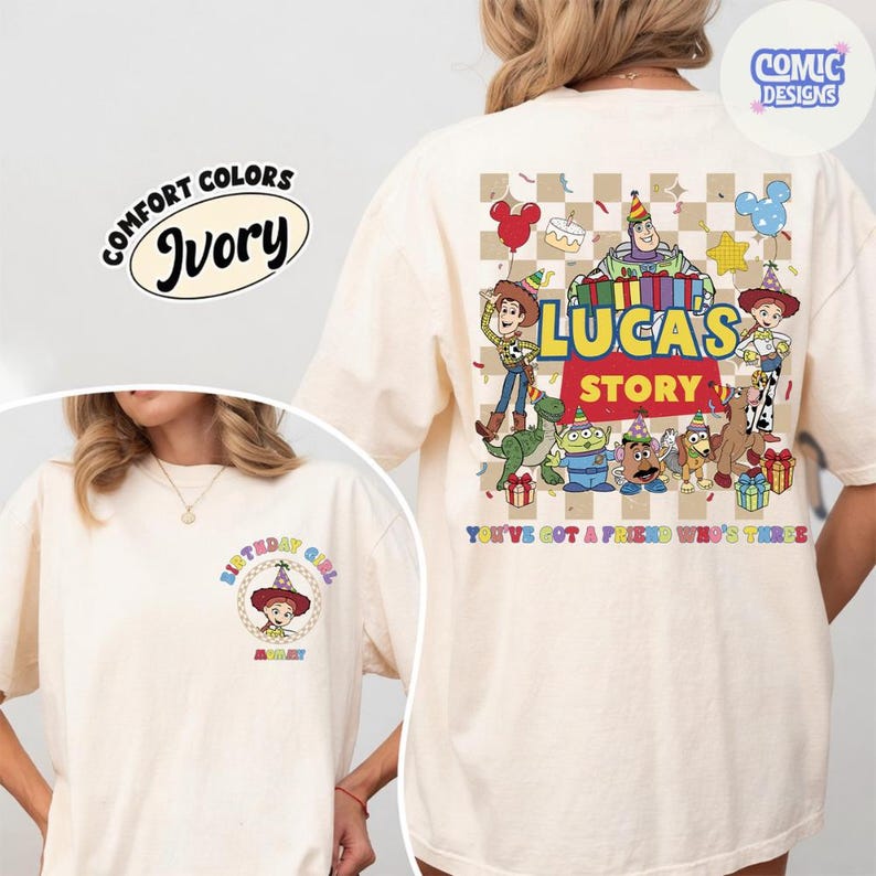 May include: Ivory-coloured t-shirt with a graphic featuring characters from a popular animated film. The back design includes the text "LUCAS'S STORY" and "YOU'VE GOT A FRIEND WHO'S THREE". The front has a smaller design with the text "BIRTHDAY GIRL".