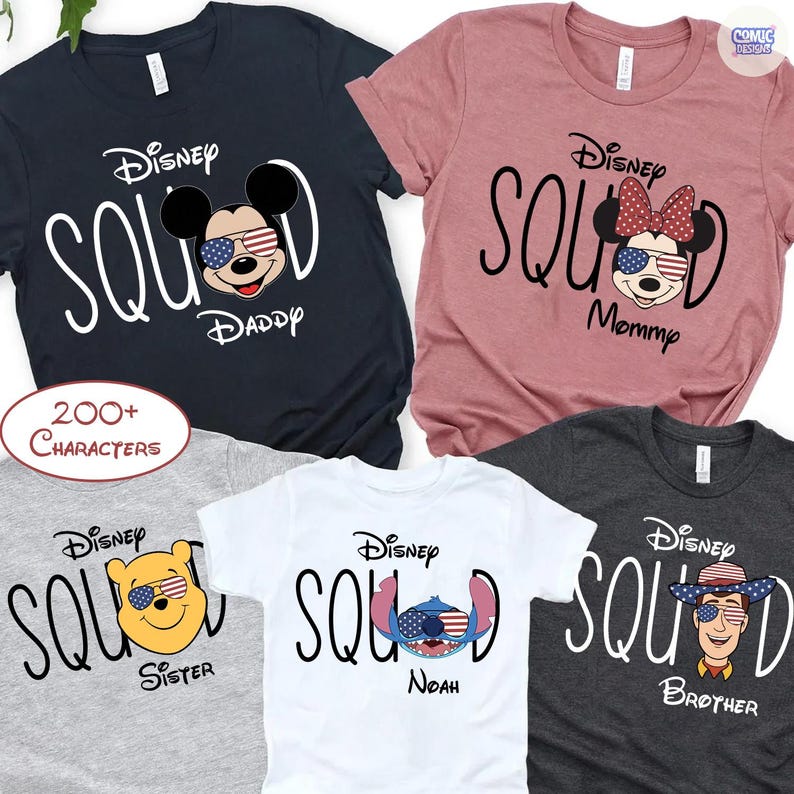 May include: A collection of Disney Squad t-shirts in various colors, including navy, pink, gray, white, and charcoal. Each shirt features a Disney character with patriotic sunglasses and the words "Daddy," "Mommy," "Sister," "Noah," and "Brother."