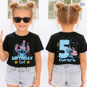 May include: Black t-shirt with a Stitch graphic, a birthday hat, and the text "BIRTHDAY GIRL". The back of the shirt features a large blue number 5, Stitch, a cake, and the name "Charlotte".