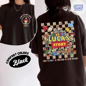 May include: Black t-shirt with a cartoon graphic and the text "BIRTHDAY GIRL MOMMY" on the front. The back features a checkered pattern with cartoon characters and the text "LUCAS STORY" and "YOU'VE GOT A FRIEND WHO'S THREE".
