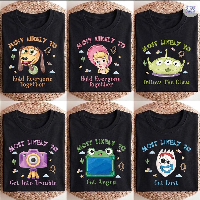May include: Six black t-shirts featuring cartoon character graphics and text. Designs include Slinky Dog with 'Most Likely To Hold Everyone Together', Cinderella, an alien with 'Follow The Claw', a camera, a frog, and Forky with 'Get Lost'.