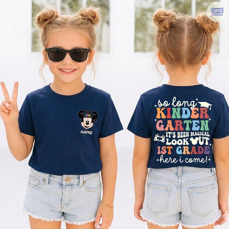May include: A navy blue t-shirt with a Mickey Mouse graphic and the text "NAME". The back of the shirt has the text "so long KINDERGARTEN IT'S BEEN MAGICAL LOOK OUT 1ST GRADE +here i come!+". The girl is wearing sunglasses and denim shorts.