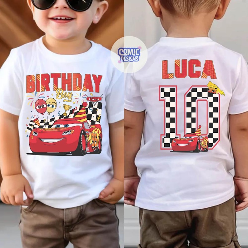 May include: White t-shirt with a red "BIRTHDAY BOY" graphic and a cartoon race car design. The back of the shirt features the name "LUCA" and the number "10" with a checkered flag design. A fun birthday shirt.