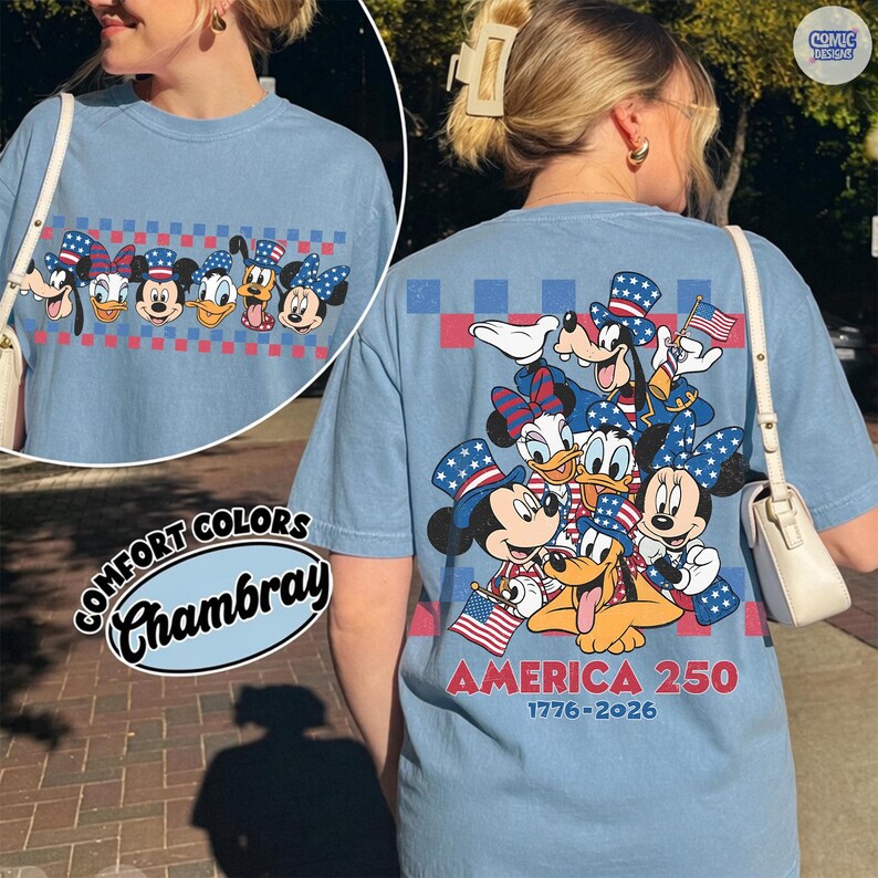May include: Light blue Comfort Colors Chambray t-shirt featuring a patriotic design with Disney characters. The front has a row of characters, and the back displays a group of characters with the text "AMERICA 250 1776-2026".