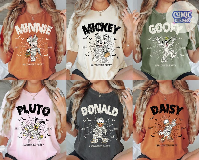 May include: A collection of six short-sleeve t-shirts in various colors, each featuring a Disney character dressed as a mummy in a spiderweb, with the text "HALLOWEEN PARTY" and the character's name printed above, plus "EST." and a year below.
