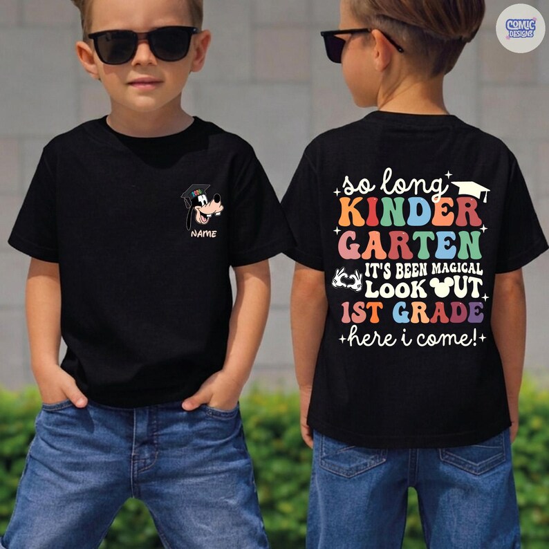 May include: Black t-shirt with a cartoon Goofy graphic wearing a graduation cap. The back of the shirt has colorful text that reads "so long KINDER GARTEN, IT'S BEEN MAGICAL, LOOK OUT 1ST GRADE +here i come!+"