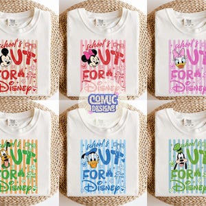 May include: Six white t-shirts with different Disney character graphics. Each shirt features a character like Mickey Mouse, Minnie Mouse, Daisy Duck, Pluto, Donald Duck, and Goofy, along with the text "School's Out For Disney".