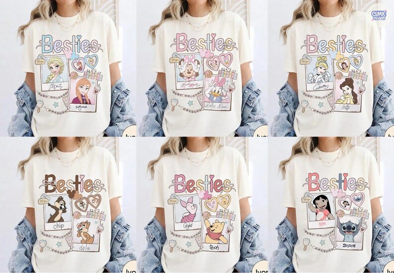 Puede incluir: Camisetas color crema con la palabra "Besties" en colores pastel. Cada camiseta presenta un par diferente de personajes de dibujos animados en marcos estilo polaroid, con corazones y estrellas decorativas. Las camisetas son parte de una colecci&oacute;n de camisetas gr&aacute;ficas.
