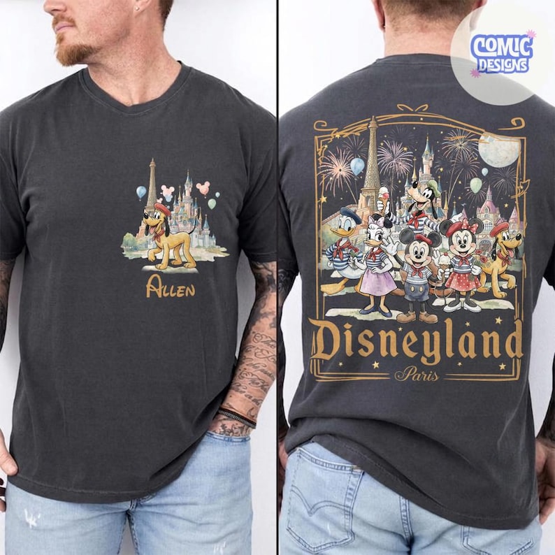 May include: A charcoal gray t-shirt featuring a small graphic on the front chest of Pluto in front of a castle with the name Allen below. The back displays a large illustration of Mickey, Minnie, Donald, Daisy, and Goofy at Disneyland Paris.