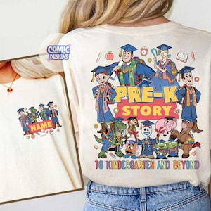 May include: Off-white t-shirt featuring a colorful graphic of animated characters in graduation attire. The design includes the words "PRE-K STORY" and "TO KINDERGARTEN AND BEYOND". A smaller image on the left shows a similar design with the word "NAME".