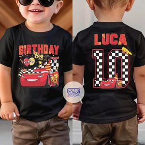 May include: Black t-shirt featuring Lightning McQueen from the Cars movie. The front of the shirt says "Birthday Boy" with a graphic of the race car. The back of the shirt has the name "Luca" and the number "10" in a checkered pattern.