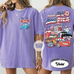 May include: A violet Comfort Colors t-shirt with a cartoon car design and the text "Happy America 250". The front of the shirt has a blue car design with the text "Name".