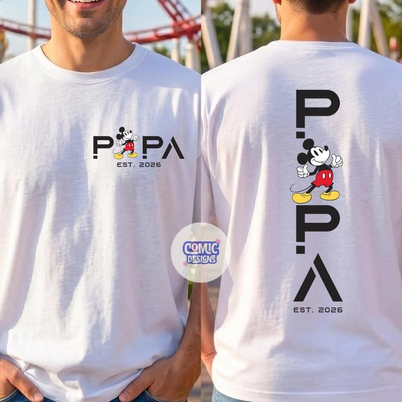 May include: White t-shirt featuring the word "PAPA" with a Mickey Mouse graphic and the text "EST. 2026". The back of the shirt has the word "PAPA" vertically with a Mickey Mouse graphic and the text "EST. 2026".