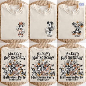 Puede incluir: Camisetas de color crema con dise&ntilde;os de personajes de Disney con tem&aacute;tica de Halloween. Las camisetas muestran a Mickey y Minnie Mouse con disfraces de esqueleto, y el texto "NAME". Otras camisetas tienen un grupo de personajes con el texto "Mickey's Not So Scary Halloween Party".
