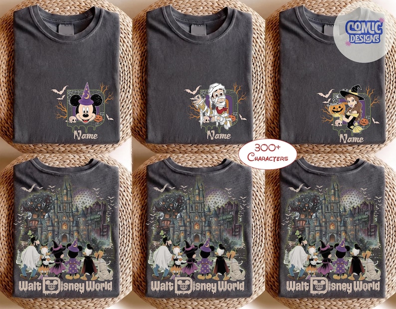 May include: A collection of charcoal gray t-shirts featuring Disney-themed Halloween graphics. Some shirts display individual characters like Mickey Mouse, a mummy, or a witch, while others show a group of characters before a haunted castle.