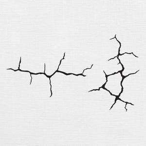 May include: Two black crack graphics on a white background. The cracks have a jagged, irregular shape, resembling fissures or breaks. The image has a minimalist aesthetic, suitable for various design applications.
