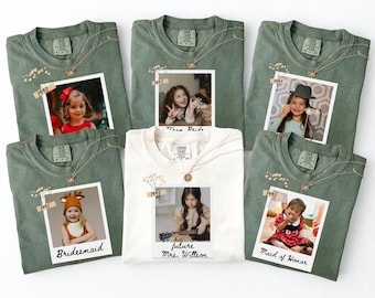 May include: Six t-shirts, including five green and one white, are displayed. Each shirt features a photo, a necklace, and text. The photos show children. The text includes "Bridesmaid," "Team Bride," and "Maid of Honor."