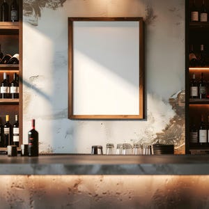 May include: A bar scene with a wooden-framed blank sign on a textured wall. Shelves on either side hold wine bottles. A concrete bar with glasses and a stool are in the foreground. The lighting is warm.