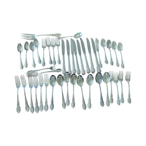 May include: A large collection of silver-toned flatware including various dinner forks, salad forks, knives, and spoons. Each piece features a polished metallic finish with a decorative embossed pattern on the handle, arranged in a grid formation.