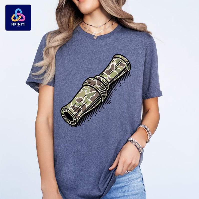 a woman wearing a t - shirt with an image of a rolled up rolled up
