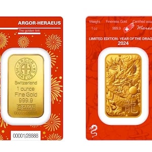 May include: A gold bar from Argor-Heraeus, Switzerland, featuring a dragon design for the Year of the Dragon 2024. The bar weighs 1 oz of 999.9 fine gold and is presented on a red card with decorative elements and text.