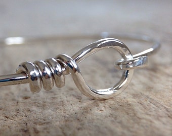 Equestrian bracelet in shiny sterling silver. Stackable hook and eye skinny bangle. Minimalist bracelet. Boho jewelry.