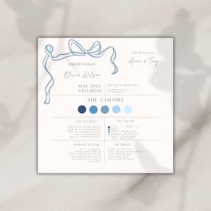 May include: A wedding invitation with a light blue ribbon design at the top. The text includes the names "Anna & Tony", "Bridesmaid Olivia Wilson", and the date "May 21st Saturday". The invitation also lists the venue, "The Olive Grove Inn, Savannah GA".
