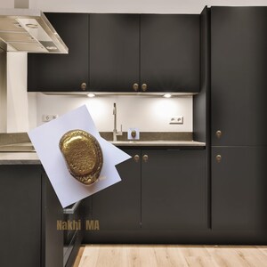 solid brass cabinet knobs, whose earthy, tactile look pays homage to nature's beauty of imperfection. Hand-cast and hand-finished , every piece emerges as a one-of-a-kind sculptural object that is rich with character and antique brass glow.

Brass Handle,
Textured Handle,
Brass Hardware,
Modern Cabinet,
Handmade Handle,
Antique Brass,
Furniture Hardware,
Natural Handle,
Artisan Brass Handle,
Solid Brass Handle,
Kitchen Handle,
Wardrobe Pull Handle,
Brass Knob,