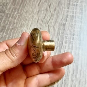 Set of 2 artisan-made solid brass knobs with a natural textured surface and aged golden finish, combining timeless elegance with modern practicality.   solid brass handle, handmade cabinet knob, brass drawer pull, vintage brass hardware, ornate door knob, mid-century hardware, luxury brass handle, round cabinet pull, decorative brass knob, classic door pull, metal cabinet handle,