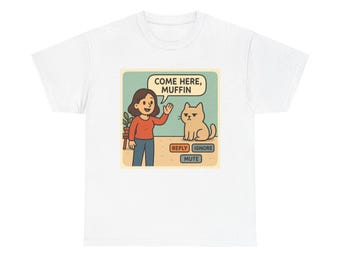 May include: White t-shirt with a cartoon graphic. The design depicts a person beckoning a cat, with the words "COME HERE, MUFFIN." Underneath are the words "REPLY", "IGNORE", and "MUTE".