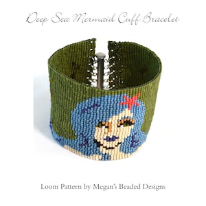 May include: A green, blue, and white beaded cuff bracelet with a mermaid design. The bracelet is made with seed beads and features a detailed mermaid face with a red starfish.
