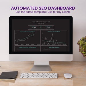 May include: A desktop computer displays a dark dashboard with graphs and data, labeled "Search Performance Overview (UK)". The screen shows the text "AUTOMATED SEO DASHBOARD" and "Use the same template I use for my clients". A keyboard, mouse, notebook, and pen are on the desk.