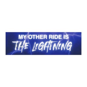 May include: A rectangular sticker with the text "MY OTHER RIDE IS THE LIGHTNING" in white, stylized font. The background is a gradient of dark blue with lightning bolt graphics.