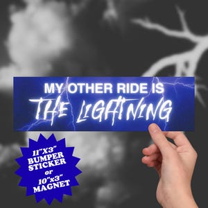 May include: A blue bumper sticker or magnet with the text "MY OTHER RIDE IS THE LIGHTNING" in white, with lightning bolt graphics. The sticker is 11"x3" or the magnet is 10"x3".