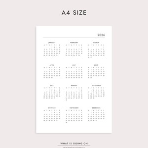 May include: A4 size minimalist planner for the year 2026. The white paper features a yearly calendar layout with each month displayed. The text "WHAT IS GOING ON" and "minimalist planners" are at the bottom.
