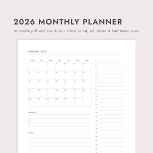 May include: A white 2026 monthly planner with a simple design. The planner includes a calendar for January 2026, with space for priorities and notes. The text "2026 MONTHLY PLANNER" is at the top.