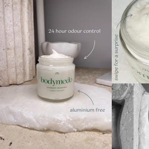 May include: A white jar of body balm deodorant with the text "bodymedo" and "bodybalm deodorant" in green lettering. The jar is on a white surface with the text "24 hour odour control" and "aluminium free" written in black. The text "swipe for a surprise" is written in black on a white background.