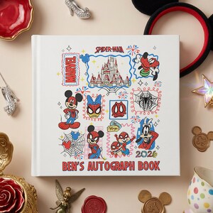 May include: A white square autograph book titled BEN'S AUTOGRAPH BOOK with colorful illustrations of Marvel and Disney characters, including Spider-Man, Mickey Mouse, and a castle, along with the year 2026 printed in red, blue, and black ink.