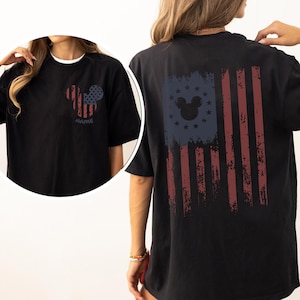 May include: A white ceramic mug with a black handle and the text "But First, Coffee" in a handwritten style. The mug is on a white surface. The mug is 4 inches tall.