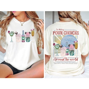 May include: Off-white t-shirt with a vibrant print of cocktails and the text "I'm Making POUR CHOICES Around the world." The design includes a margarita, milkshake, and other drinks. The back of the shirt has the same design.